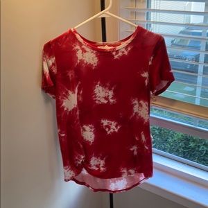 red and white shirt with knot at bottom